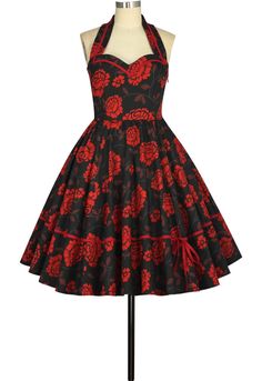 Gift of flowers! This floral beauty features a sweetheart neckline with a red-trim faux collared look. You can find bold red roses and daisys on a black background with grey vines and burgundy leaves intertwined, and the red trim on the skirt of the dress ties into a bow for a sweet look. Zips up the size.Fabric: 97% Cotton 3% Spandex Wonder Woman Fancy Dress, Plus Size Dresses Uk, October Photoshoot, Steampunk Store, Office Party Ideas, Pinup Skirt, Christmas Office Party, Office Party Outfits, Rockabilly Mode