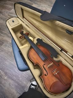 a violin is sitting in an open case