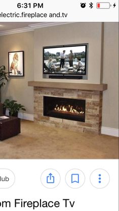 a flat screen tv sitting on top of a fireplace