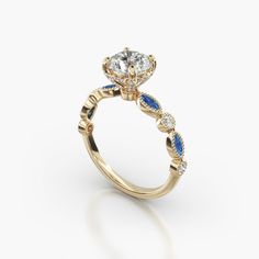 a yellow gold ring with blue and white stones on the side, set in 18k gold