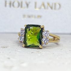 Don't miss this opportunity to own this beautiful gemstone ring! => Gemstone Type - Peridot, Clear Quartz => Gemstone Cut - Faceted => Gemstone Size - 8*10 mm, 3 mm => Total Number of Gemstones - 5 => Metal Type - 14k Gold Filled (Tarnish Resistant and Nickel Free) - also available in 925 sterling silver and 14k solid gold * Please contact me for pricing on sizes larger than 11 * ~ Feel free to ask me about custom made designs. ❏ Replacements and custom orders: ✪ 925 sterling silver - no additio Luxury Modern Gold Birthstone Ring, Green Rectangular Diamond Ring With Prong Setting, Green Radiant Cut Ring For Anniversary, Radiant Cut Ring With Prong Setting For May Birthstone, Green Radiant Cut Ring With Prong Setting, Radiant Cut May Birthstone Ring With Prong Setting, Green Radiant Cut Rings With Accent Stones, Green Emerald Cut Crystal Ring With Center Stone, Radiant Cut Green Rings With Accent Stones