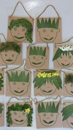 paper bags with faces and plants on them