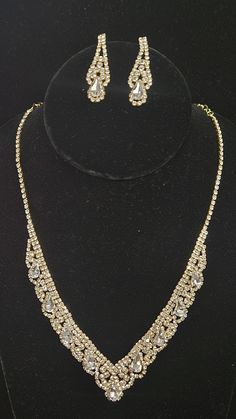 Necklace Size : 16" + 3" L Decor Size : 0.75" L Earring Size : 1.5" L Rhinestone Pave Crystal Teardrop Detail V Necklace Gold Prom Necklace, Gold Jewelry For Prom, 2 Piece Dress Short, Prom Gold, Prom Necklace, V Necklace, Designer Formal Dresses, Prom Necklaces, Gold Prom