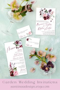 the wedding stationery is displayed with flowers