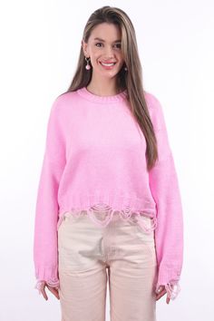 Made from 100% cotton, the "Ripped Crop Sweater" is a trendy clothing item that combines the comfort of a sweater with a trendy, distressed look. This distressed look is a popular style in fashion.Featuring long sleeves and a scoop neck, the "Ripped Crop Sweater" is a fashionable and versatile addition to one's wardrobe. High-waisted jeans can be paired with a variety of bottoms, such as shorts, skirts or layered dresses. The ripped details give it a slightly edgy and casual look; This makes it Trendy Crew Neck Cropped Sweater For Spring, Casual Fall Sweater With Frayed Hem, Trendy Crew Neck Cropped Cotton Sweater, Trendy Cotton Cropped Sweater With Crew Neck, Trendy Cotton Crew Neck Cropped Sweater, Trendy Cropped Cotton Sweater For Fall, Trendy Cotton Cropped Sweater For Fall, Casual Winter Tops With Frayed Hem, Spring Layering Cropped Cotton Sweater