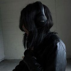 a person with headphones on their ears