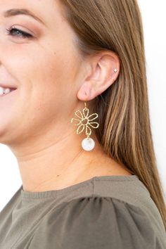 Enhance your ensemble with a delicate floral touch by donning these Maisy Earrings - Cream. Composed of a gold alloy, these earrings feature striking daisy charms crafted from 18K gold-plated hypoallergenic stainless steel, paired with lightweight and durable plant-based acrylic. Perfect for complementing a sundress, these earrings will add a playful and distinctive flair to your look. Elegant Gold-plated Flower Earrings, Formal Yellow Gold-plated Flower Earrings, Chic Gold Flower-shaped Earrings, Elegant Gold-plated Flower Charm Earrings, 14k Gold Hypoallergenic Flower-shaped Earrings, Daisy Charm, Gold Alloys, Next Clothes, Plant Based