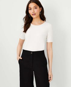 Elevate your wardrobe with the Ann Taylor Petite Sweater T-Shirt, a perfect blend of comfort and chic style. This winter white top is designed to flatter with a fitted silhouette and crafted from a soft blend of 62% viscose and 38% nylon, ensuring both warmth and breathability.

- Size: Petite XS
- Color: Winter White
- Material: 62% Viscose, 38% Nylon
- Gender: Female
- Length: 23 1/2" long
- Fit: Fitted
- Features: Crew neck, short sleeves, ribbed neckline, cuffs, and hem
- Care Instructions: Tops For Petite Women, Capsule Wardrobe Women, Ann Taylor Petite, Petite Sweaters, Knitted Suit, Summer Sweaters, Smart Casual Outfit, Petite Women, Work Outfits Women