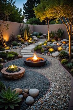 an outdoor fire pit surrounded by rocks and plants