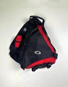 This vintage Oakley Slingbag is a versatile and stylish accessory for men. It features a retro design that is perfect for any casual outfit. The bag comes in an all-black exterior made of durable ripstop and ballistic nylon material. This sling style backpack has a crossbody strap handle for easy and comfortable carrying. The bag is equipped with a zip and buckle closure, making sure that all your items are secure. With its large capacity and sleek design, this Oakley Sandbag is perfect for everyday use. The condition can be seen in the photo, the bag has been used but there are no traces! All what included on first photo  Worldwide shipping 10-21days Vintage Sling Bag, Vintage Oakley, Black Exterior, Red Fashion, Stylish Accessories, Retro Design, Sling Bag, Crossbody Strap, Casual Outfit