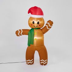 an inflatable ginger with a santa hat and scarf