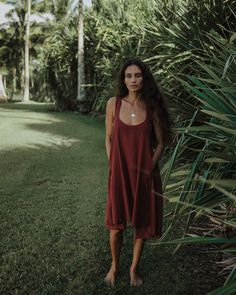 This item is final sale. A staple summer dress is crafted from breezy handwoven cotton fabric, cut for a relaxed fit and an A-line silhouette. The wide shoulder straps, deep pockets, scoop neckline and flowy fit are finishing touches to this sustainable dress. - Length: 36” - Fabric: Handwoven cotton - Color: Umber/brown Beach Cotton Midi Dress With Adjustable Straps, Scoop Neck Summer Slip Dress, Flowy Sleeveless Sundress For Loungewear, Summer Cotton Midi Dress For Loungewear, Summer Midi Dress With Pockets For Day Out, Casual Cotton Slip Dress For Summer, Summer Scoop Neck Dresses For Vacation, Summer Scoop Neck Vacation Dresses, Summer Dresses With Scoop Neck For Vacation