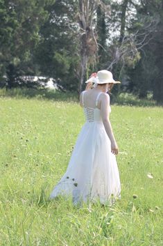 A must-have dress for spring and summertime, the Meadowlark midi features a vintage-style boned bodice with open, lace-up corset back, adjustable shoulder straps, a flowy tea-length skirt, and romantic sweetheart bustier neckline. A note on sizing- while this dress has an adjustable bust size due to the corset-style back, the waist is a single measurement and has no stretch, please choose your size accordingly! . Details: S: Bust: 32"-36", Waist 26" M: Bust 34"-38", Waist 28" L: Bust 36"-40", Wa Spring A-line Corset Dress With Corset Back, Spring A-line Corset Dress With Fitted Bodice, Summer A-line Corset Dress For Prom, Summer Underbust Dress With Corset Back, Summer Dress With Lace-up Back And Fitted Bodice, Summer A-line Corset Dress With Adjustable Straps, Spring A-line Corset Dress For Prom, Elegant Spring Dresses With Underbust Shape, Spring Wedding Corset Dress With Lace-up Back