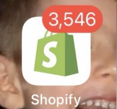 a young boy smiling and holding a shopping bag with the number 3, 546 shopify on it