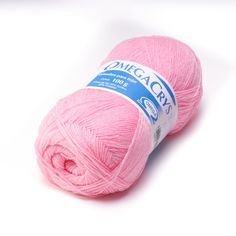 a pink ball of yarn sitting on top of a white surface with the word dwegacrs written across it