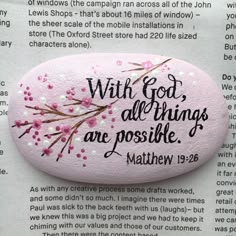 a pink rock with the words, with god all things are possible