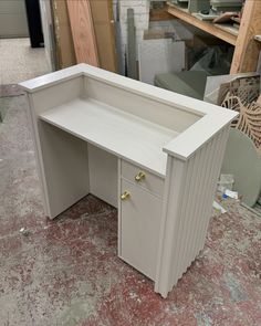 an unfinished desk is shown in the process of being painted and put together with other furniture