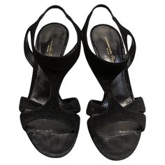 Black velvet sandals with open toe and crossed straps. Made In: Italy Color: Black Material: Velvet Marked Size: 38 Europe Heel Height: 11,5 cm/ 4,53 inches To introduce you to the figure of Gianvito Rossi we could start with the proverb that says that 'caste comes to the greyhound', so at a glance you would find out that he belongs to a saga of great shoemakers 'made in Italy'. His father was Sergio Rossi, a master expert in footwear who left us last April at the age of 85 due to the coronaviru Evening Slingback Sandals With Wrapped Heel And Open Toe, Elegant T-strap Slingback Sandals For Evening, Black Open Heel T-strap Sandals For Party, Black T-strap Sandals With Open Heel For Party, Chic Black T-strap Sandals For Evening, Formal Wedge Sandals With Heel Loop And Open Toe, Formal Open Toe Wedge Sandals With Heel Loop, Black Round Toe T-strap Sandals For Evening, Black Open Heel T-strap Sandals For Formal Occasions