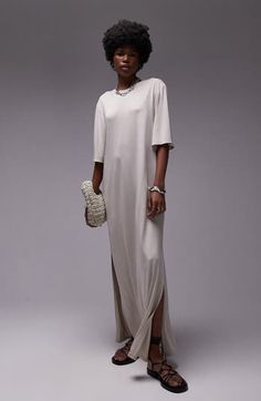 Made from supple jersey, this flowy maxi dress is simply styled so you can show off your accessories or keep it minimalist. Crewneck Elbow-length sleeves Side-seam pockets Side slits 100% polyester Machine wash, line dry Imported T Shirt Dress Maxi, Chic Beige Maxi Dress With Side Slits, Beige Maxi Dress With Side Slits, Spring Neutral Maxi Dress, Elegant Beige Relaxed Fit Maxi Dress, Casual Beige Maxi Dress For Evening, Beige Relaxed Fit Maxi Dress, Elegant Oversized Short Sleeve Maxi Dress, Shirt Dress Maxi