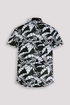 This short-sleeve button-up shirt features a sleek tropical leaf pattern in black and white. Perfect for adding a touch of sophistication to any outfit. Made with high-quality materials for a comfortable and stylish look. Boost your wardrobe with this versatile and trendy shirt. 95% Cotton 5% Spandex Machine wash cold, Tumble dry low, Wash with like colors, Do not bleach. Imported B4WS707 Size Chart Size S M L XL XXL Chest (inches) 36.5 - 38.5 38.5 - 40.5 40.5 - 42.5 42.5 - 44.5 44.5 - 46.5 Meas Black Button-up Hawaiian Shirt For Beach, Black Short Sleeve Hawaiian Shirt For Summer, Black Tropical Shirt For Summer, Tropical Black Summer Shirt, Black Camp Shirt With Graphic Print For Vacation, Black Graphic Print Camp Shirt For Vacation, Black Button-up Camp Shirt For Beach, Black Button-up Camp Shirt For The Beach, Black Button-up Shirt For Vacation