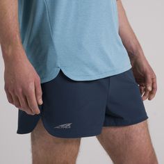 It’s light, it’s breathable, and it’s ready to go fast. The Vanish 2” Short is made from recycled, moisture wicking, stretch woven material and features a brief liner. Chase some speed with this short designed for performance, featuring an invisible zip pocket to hold your necessities and an interior draw cord for the perfect fit. Whether you’re tackling a speed workout or toeing the line at a race, these shorts were made to help you perform. | Altra Running Men's Vanish 2" Short in Navy, Size: Speed Workout, Smartwool Socks, Running Apparel, Running Man, Line At, Invisible Zip, Gym Training, Road Racing, Running Clothes