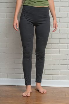 "Women's Hemp and Cotton Leggings Our hemp, cotton, spandex leggings are perfect for working out, walking, running, traveling, lounging at home, while being stylish enough to wear out. * Soft, supple & eco-luxury legging * 3 1/2\" yoga waistband * 29-30\" inseam Fabric: 52% Hemp 43% Cotton 5% Spandex Color Options: Black or Gray (Our leggings normally come plain without logo or printing. However, if you are interested in the our new yoga logo on your yoga leggings, pants, shorts, crop tops,