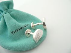 Overview: Offered for sale is a pair of classic and super cool Tiffany and Co. Sterling Silver 1837 Concave Cuff Links. Beautiful piece of "jewelry" that every man or woman can appreciate! Perfect surprise for that someone special! The pair is in excellent condition! The links are fully hallmarked and guaranteed to be 100% authentic.You will not regret purchasing these! :)It will come with its Tiffany pouch as shown! Perfect and ready for gifting!Wonderful present for yourself or anyone you love Loyalty Program, Tiffany And Co, Gift Pouch, Every Man, Cuff Links, Tiffany & Co., Someone Special, Cufflinks, Pouch