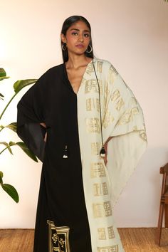 Introducing a chic mid-length kaftan, a perfect fusion of style and comfort. Crafted with a classic v-neckline and adorned with a contrasting border detail along the neckline and sleeve hem, this kaftan exudes understated elegance. The black contrast adds a sophisticated touch, while the mid-length design offers versatility for various occasions. Paired with a coordinating slip for added coverage and comfort, this kaftan is ideal for both casual outings and special events, ensuring you look effo Understated Elegance, Mid Length, Special Events, The Black, Black White, Black And White, White, Black, Design