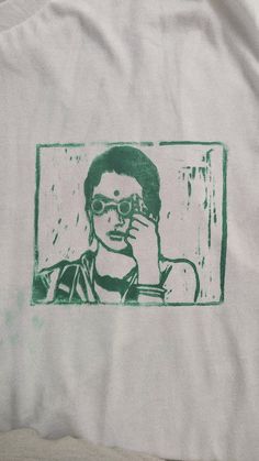 Charulata Handprinted Lino Block Print T-Shirt, Unisex T-Shirt, Cotton T-Shirt, Trendy casual t-shirt Comes with a Charulata, Satyajit Ray Print This tshirt can be given as a gift Wash Care Easily Home Washable Stencil T Shirt, Artistic Green Cotton T-shirt, Hand Printed Cotton Graphic Tee, Hand Printed Crew Neck Graphic Tee, Hand Printed Graphic Tee With Crew Neck, Hand Printed Graphic Tee With Short Sleeves, Artistic Cotton T-shirt With Front Print, Artistic Cotton Tops With Graphic Print, Hand Printed Short Sleeve Graphic Tee