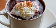 a cup of hot chocolate with whipped cream on top