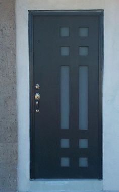 a black front door with glass inserts