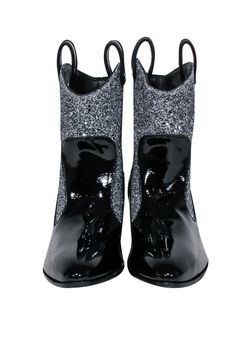 Take a walk on the stylish side with these dazzling black patent Guiseppe Zanotti boots. The upper features a touch of sparkle with silver glitter, while the pointed toe adds a touch of sophistication. Pair them with a little black dress for a classic, timeless look or add some edge with ripped jeans and a leather jacket. Size 9 (IT 39) Soft Patent Leather Made in Italy Varnished effect Glitter upper Pointed toe Cuban heel Leather lining Leather sole Boot shaft 6.5” Boot circumference 12” Heel h Black Party Boots With Silver Accents, Silver Studded Leather Boots With Pointed Toe, Silver Pointed Toe Boots With Silver Studs, Silver Glitter Pointed Toe Boots, Luxury Silver-studded Ankle Boots, French Girl Chic, Cuban Heels, Buy Shoes Online, Take A Walk