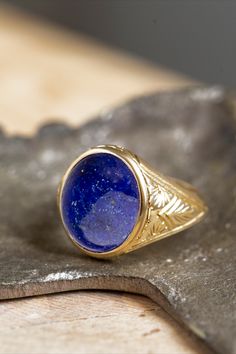 A beautiful signet ring with carvings on the sides made by hand and a cabochon lapis lazulis gemstone in the center. *real images of the ring, taken by us* Lapis Lazuli Stone Size: 14x12mm Material: - Sterling Silver 925 - 9K Gold (375) - 14K Gold (585) - 18K Gold (750) *All signet rings are hallmarked on the back for certification* - We offer FREE Worldwide DHL & FedEx Shipping! - Branded DanelianJewelry Gift Box with each order! Blue Engraved Jewelry For Ceremonial Occasion, Ceremonial Blue Engraved Jewelry, Carved 14k Gold Signet Ring As Gift, Oval Ceremonial Carved Jewelry, Heirloom Blue Signet Ring, Classic Carved Ceremonial Jewelry, Formal Blue Engraved Signet Ring, Classic Lapis Lazuli Ring With Polished Finish, Classic Lapis Lazuli Jewelry Ring