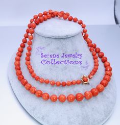 Very pretty 14k gold Vintage bead necklace with tomato red Japanese Momo Coral polished rounds. Momo is quite rare now, as the source is not available anymore, especially ones in this darker shade of red. The necklace is a long 34.5 inches long so can be worn long or double looped. The clasp is in a floral design with a coral cabochon highlighting the center. Total Weight: 82.5 grams Length: 34.5 inches 14k gold clasp with coral cabochon center: 12mm Precious Metal: 14k gold Precious stones: -Co 14k Gold Single Strand Jewelry With Round Beads, Elegant Orange Hand-strung Necklace, Elegant Red Coral Jewelry With 8mm Beads, Elegant Orange Jewelry With 8mm Beads, Classic Red Coral Formal Jewelry, Single Strand 14k Gold Jewelry With Round Beads, Formal Yellow Gold Jewelry With Red Coral, Formal Orange Single Strand Necklace, Hand-strung Round Red Coral Jewelry