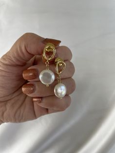 Looking for simple but gorgeous pearl earrings tonight your bridesmaids on your wedding day? These coin pearl drop earrings are simple, light and yet elegant! Perfect  gift for your bridesmaid or for anyone you care about!  Bundle to save more! One pair: $39.95 Two pairs: $59.95, $29.97 a pair Three pairs: $69.95, $23.32 a pair Will come with a pink sliding gift box with a pretty pink soft jewelry pouch free, ready for gift giving! You can't go wrong with this simple jewelry gifts for her! The coin pearls are AAA quality, super lustrous, gorgeous! The coin dangling pearls are genuine, white, super lustrous, AAA quality, approx measurements 12mm to 14mm, carefully wire wrapped in gold filled wires. The ear findings are all real gold plated, won't easily tarnish, brass body. Will come with l 14k Gold Filled Pearl Drop Earrings For Anniversary, Minimalist Pearl White Bridal Earrings With Pearl Drop, Minimalist Pearl White Pearl Drop Bridal Earrings, Minimalist Pearl Earrings For Parties, Minimalist Pearl Drop Earrings For Party, Dainty Pearl Charm Earrings For Parties, Minimalist Baroque Pearl Earrings For Gift, Minimalist Baroque Pearl Chain Earrings, 14k Gold-filled Pearl White Earrings With Pearl Charm