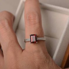 Engagement ring natural garnet ring emerald cut red | Etsy Red Emerald-cut Sterling Silver Birthstone Ring, Emerald Cut Red Birthstone Ring, Red Emerald Cut Birthstone Ring, Red Emerald Cut Birthstone Promise Ring, Garnet Emerald Cut Promise Ring, Emerald Cut Garnet Promise Ring, Rectangular Garnet Rings In Red, Red Emerald Cut Sterling Silver Ring, Silver Emerald-cut Garnet Jewelry