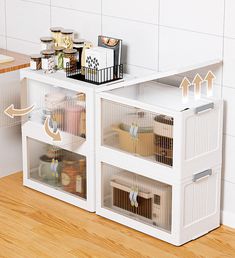 a white shelf filled with lots of containers on top of a wooden floor next to a counter