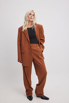 These suit pants feature a waistband with belt loops and a zipper, hook and button closure. They have a pleat detail on the front and 2 front pockets. These suit pants feature 2 mock back pockets and wide, straight legs. Inseam length in size 36: 80 cm / 31.49 in. Rust Long Pants, Madewell Pant Suit, Suits Straight Pants, Rust Pants Women, Cognac Effortless Pant, Straight Leg Pant Suit Women, Women’s Suit Pants Wide Leg, Suits For Women Straight Leg, Womens Suits Wide Leg