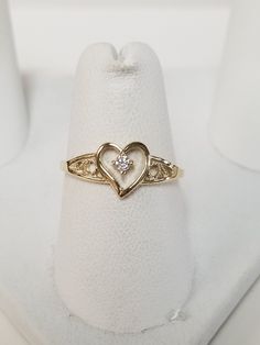 "Thanks for shopping our vintage estate store. We tend to sell well below wholesale and truly hope you enjoy all of our items. Many of the items are one of a kind, so please enjoy scrolling through the pictures and hopefully something will catch your eye. Brown spots are from camera. Estate 10k yellow gold .04ct cz diamond heart ring. Ring size: 6.75 CZ Diamond: .04ct Setting: 8mm 3/8\" Band width: 1mm Weight: 1.01 grams Very sweet ring. Marked 10k." Real Gold Rings, Custom Gold Jewelry, Xoxo Jewelry, Dope Jewelry Accessories, Sweet Ring, Gold Heart Ring, Diamond Heart Ring, Baby Baptism, Gold Rings Fashion