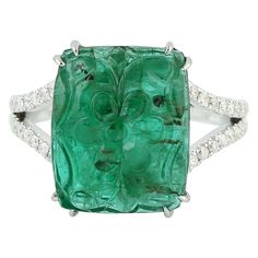 Luxury Green Rings With Diamond Accents, Luxury Emerald Birthstone Ring, Luxury Green Emerald Ring With Diamond Cut, Exquisite Green Emerald Ring With Pave Setting, Luxury Emerald Ring With Pave Setting, Luxury Tsavorite Emerald Ring, Exquisite Green Jewelry With Pave Setting, Formal Round Emerald Ring With Pave Setting, Luxury Green Intaglio Rings