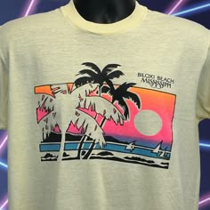 Vintage Biloxi Beach Mississippi T Shirt Mens Medium 80s Sailing Sailboats Nautical Yachts Yachting Palm Trees Sunset Yellow Single Stitch Graphic Tee CONDITION: In gently used condition - no flaws noticed. Has been washed and is ready for you to wear. Missing tag but I feel it measures similar to a Medium. Check measurements to ensure fit. See photos. SIZE AND MEASUREMENTS: Mens/Unisex Medium Width 20" - Underarm to underarm Length 24.5" - Measure from top of shoulder at the edge of collar to t 80s Tshirt Design, 90s Shirts Graphic Tees, Biloxi Beach, Sunset Yellow, California Surf, 90s Shirts, Vintage California, Halloween News, Gulf Coast