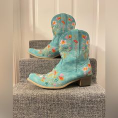 Brand New Floral Embroidered Ankle Cowgirl Boots. Originally Purchased For $56.99 On Amazon. Material Made With Vegan Synthetic Leather That Feels Like Suede With A Rubber Sole. Size 9 And Fits Wide Calf. Never Worn! Bohemian Snip Toe Boots For Spring, Bohemian Snip Toe Spring Boots, Spring Bohemian Snip Toe Boots, Blue Western Boots For Summer, Bohemian Closed Toe Boots For Spring, Spring Bohemian Ankle-high Boots, Western Turquoise Boots For Spring, Turquoise Western Boots For Spring, Embroidered Closed Toe Summer Boots