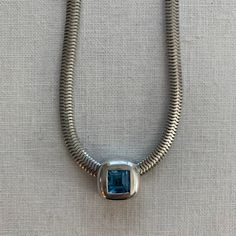 925 Sterling Silver Snake Chain With Sterling Silver & Aquamarine Stone Square Pendant. Minor Signs Of Wear - Mainly On The Back. Marking Is Worn Off. It Says “925” But The Designer Hallmark Is Unclear. Elegant Blue Necklace With Silver Chain, Elegant Blue Jewelry With Silver Chain, Blue Sterling Silver Necklace With Polished Finish, Modern Blue Topaz Blue Jewelry, Blue Sterling Silver Jewelry With Silver Chain, Hallmarked Silver Jewelry With Blue Topaz, Silver Jewelry With Blue Topaz, Formal Sterling Silver Snake Chain Necklace, Elegant Blue Necklace With Sterling Silver Clasp