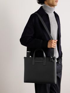 Dunhill pays tribute to its heritage with the '1893 Harness' collection, dedicated to the year the brand started crafting its fine leather saddlery. Ideal for business trips, this slim document holder has been made in Italy and features plenty of room for your laptop and notepad. The back strap is designed to slip easily over your suitcase handle. Business Bags Men, Leather Wash Bag, Tom Ford Bag, Suitcase Handle, Black Leather Backpack, Woven Tote Bag, Document Holder, Wardrobe Edit, Loungewear Shorts