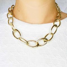 This 18 inch 14k yellow gold chain necklace has a large oval lobster clasp that is fashionable and easy to use! Large lobster clasps are the best clasps for chain necklaces, they make the chain appear seamless and allow the wearer a secure and easy way to put on and remove the necklace. The links are 17 millimeters wide with an open oval design. The chain link necklace is 18 inches long and weighs 34 grams. Chic Formal Chain Necklace With Lobster Clasp, Gold Oval Link Chain Necklace, Elegant Oval Necklace With Chunky Chain, Classic Gold Chain Necklace With Oval Pendant, Elegant Oval Chain Necklace With Lobster Clasp, Modern Oval Gold Chain Necklace, Gold Oval Chain Necklace With Lobster Clasp, Formal Oval Chain Necklace With Lobster Clasp, Modern Gold Chain Necklace