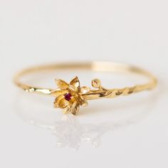 These unique solid gold birth month flower rings feature delicate and detailed flowers set with each month's birthstone. Discover this new take on personalized birth month jewelry. Rings With Birthstones, July Water Lily, August Poppy, January Carnation, Affordable Fine Jewelry, Local Eclectic, Gold Flower Ring, Flower Rings, Vintage Inspired Rings