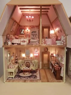 a doll house with furniture and accessories inside