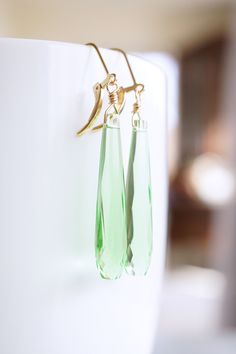 Long Gold, Peridot Quartz Teardrop Earrings, No. EGL031 :*About This Piece*: ♦︎ Elegant and classy, these bright green Peridot Quartz Drops have a vintage appeal with a timeless elegance hung from gold filled lever back earrings. ♦︎ Length - 2.2 in (55 mm) ♦︎ Width - .3 in (7 mm) ♦︎ All items from my shop are packaged in padded cardboard jewelry boxes. Custom gifting options available upon request. ♦︎ Visit my shop for more here: https://www.etsy.com/shop/storygirlcreations ♦︎ Are you looking fo Green Drop Teardrop Earrings For Formal, Green Teardrop Earrings For Formal Occasions, Formal Green Teardrop Drop Earrings, Green Faceted Earrings For Wedding, Green Faceted Teardrop Earrings, Green Teardrop Earrings For May Birthstone, Green Teardrop May Birthstone Earrings, Green Drop Crystal Earrings For Party, Cardboard Jewelry