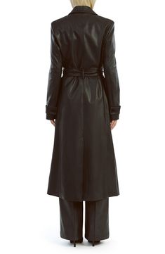 Update your outerwear portfolio with this sleek faux-leather trench coat featuring a classic notched collar and a matching tie belt. 48" length (size Small) Front button closure Notched collar Front welt pockets Removable tie belt Back vent Lined 55% polyester, 45% cotton with polyurethane coating Hand wash, line dry Imported Leather Outerwear With Belted Cuffs For Business, Business Leather Outerwear With Belted Cuffs, Black Leather Outerwear With Belted Cuffs, Fitted Leather Jacket With Belted Cuffs, Elegant Winter Leather Jacket With Belt, Elegant Belted Leather Jacket For Winter, Sleek Double-breasted Leather Outerwear, Belted Faux Leather Long Coat, Belted Long Leather Jacket For Business