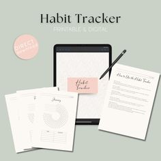 a tablet computer sitting on top of a desk next to papers and pen with the text habit tracker printable & digital